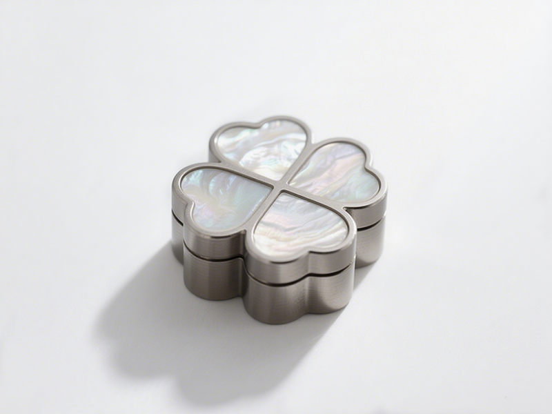 Clover shape, metal frame with mother - of - pearl inlays, iridescent texture, unique and delicate shape.