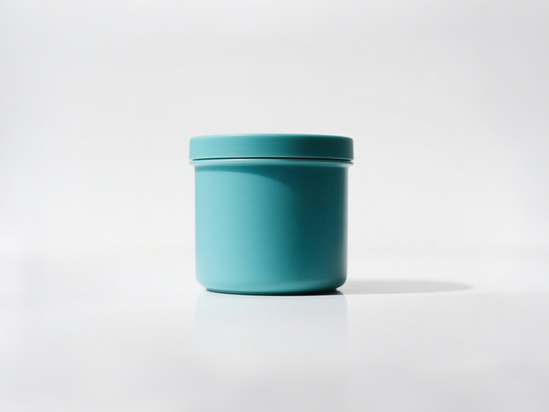 Cylindrical cyan jar, simple appearance, smooth surface, solid - color design shows fresh minimalism.